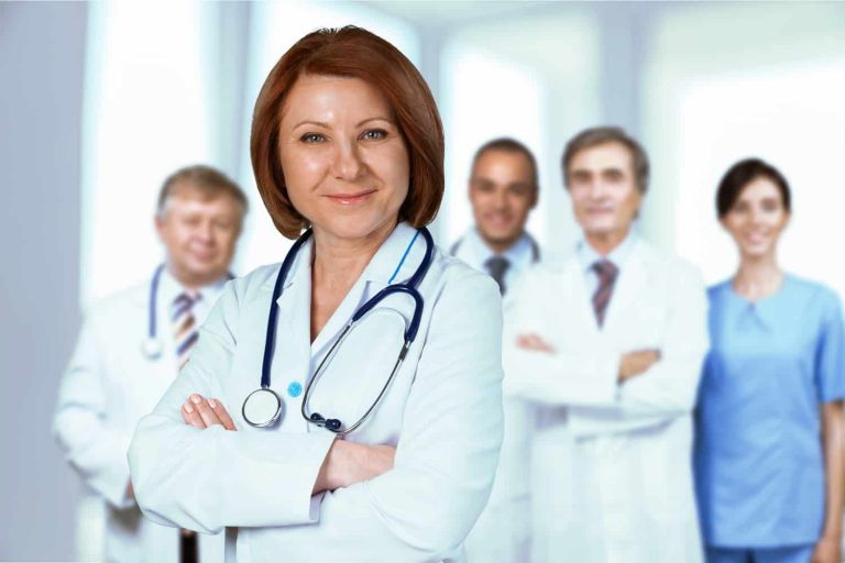 A group of doctors standing in a room.